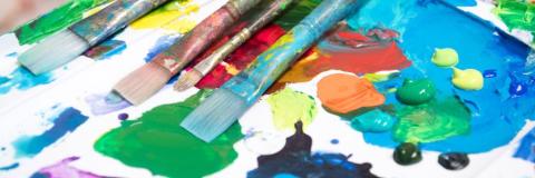 colorful paints and brushes
